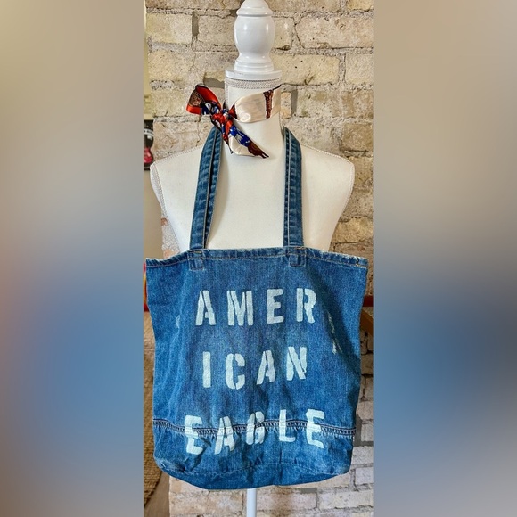 American Eagle Outfitters Handbags - American Eagle Blue Distressed Denim Tote with White Text
